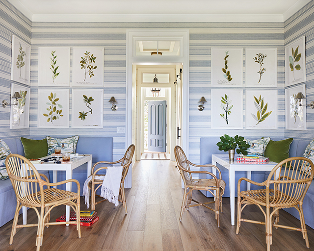 Bright dining room with patterned wallpaper and traditional architectural details