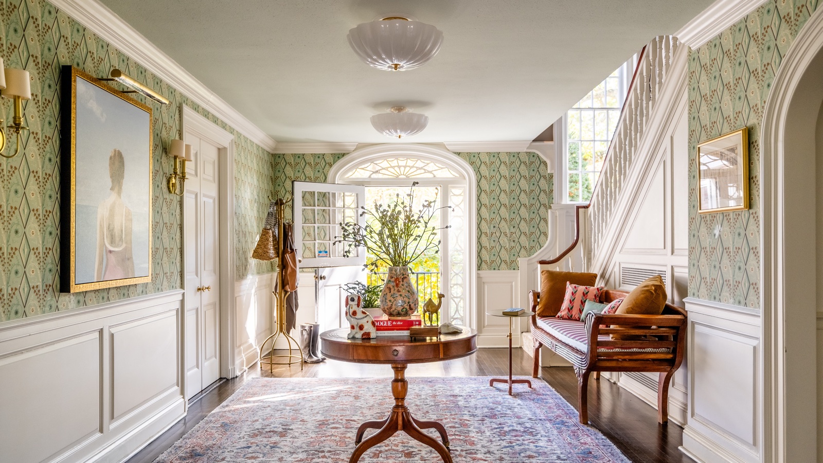 Refined residential interior with patterned wallpaper and warm furnishings
